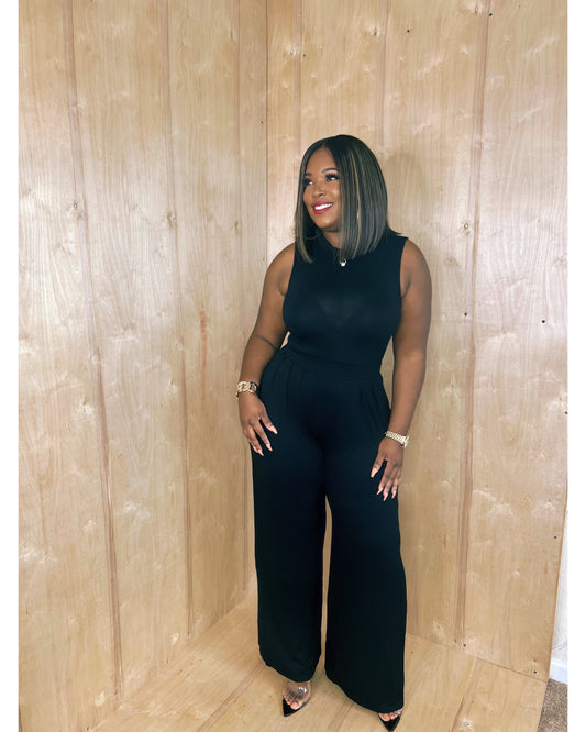 She means business palazzo pants and body suit